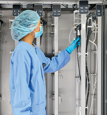 Technician storing endoscopes