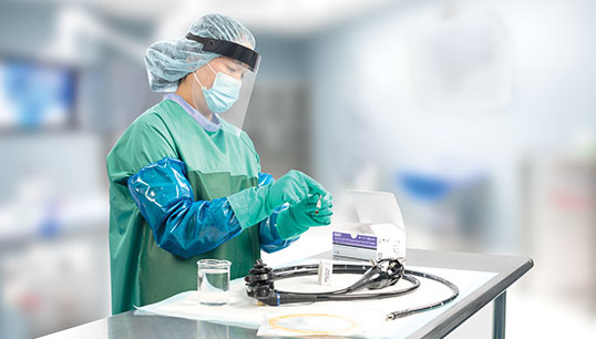 Technician using Cleaning Process Protein Indicator